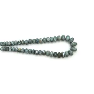 Blue Opal beads from India, polished blue gemstone beads arranged in a strand