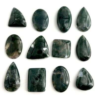 Flat Lay Showing Variety of Shape in the Moss Agate Mixed Shape Cabochons Approx 20 - 30mm 3 Piece Pack