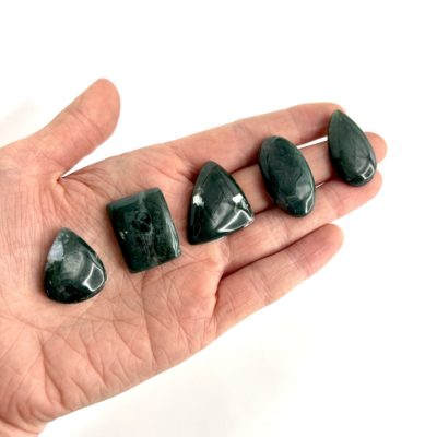 Flat Lay on Hand to Show scale of Moss Agate Mixed Shape Cabochons Approx 20 - 30mm 3 Piece Pack